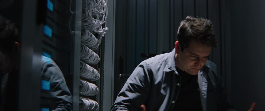 Angry IT Specialist Reacting Emotionally to Severe Infrastructure Outage During Late Night Server Room Operations. Critical System Failure, Enterprise Network Disruption, Technical Crisis, and