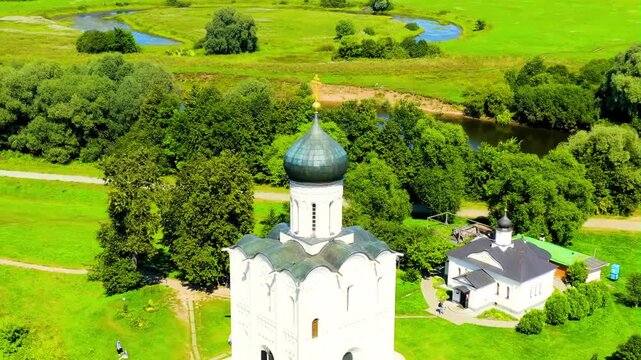 Russia, Bogolyubovo. Drone footage of Church of the Intercession on the Nerl. Orthodox church and a symbol of medieval Russia. Stable. Drone footage, Point of interest. Rich colors