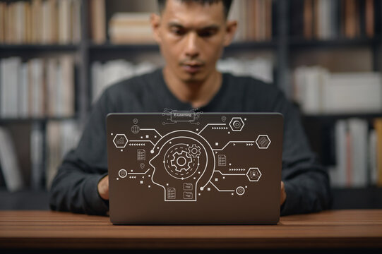 Young Man Using Laptop with Digital Technology Graphics in Modern Library
