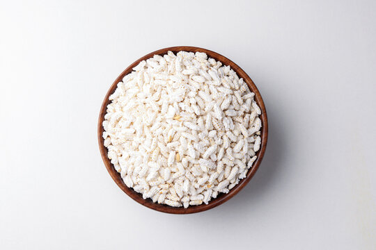 Indian popped rice or Pori also known as puffed Lahi or Karthigai pori in wooden bowl 