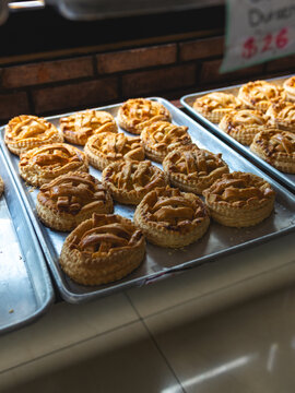 Aluminum Tray with Small Apple Pies in a Bakery