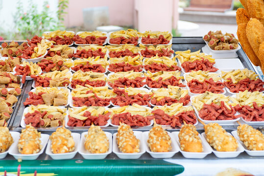 Plates of French Fries and Fried Sausages at a Mexican Street Food Stall