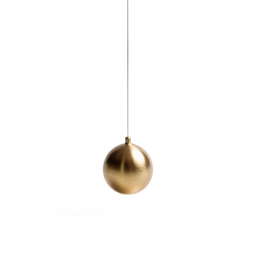 Polished brass sphere suspended from fine silver thread creating simple pendulum isolated on transparent background