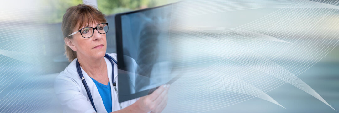 Female doctor examining x-ray report; panoramic banner