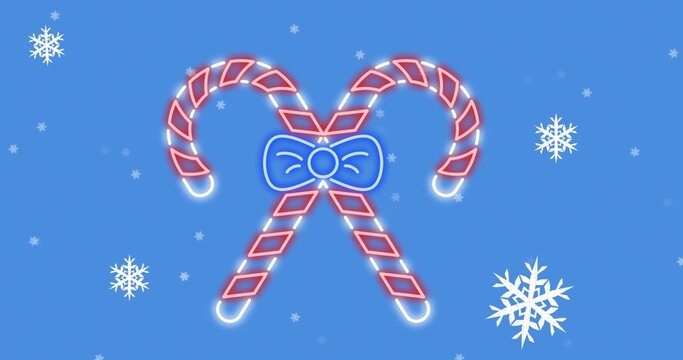 Featuring crossed red white candy canes glowing on medium blue canvas, with blue bow and snowflakes