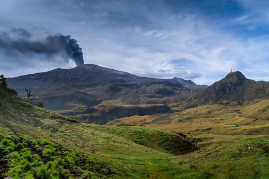 Scenic mountain valley landscape with wild grasslands and river under a cloudy blue sky, landscape.Columbia