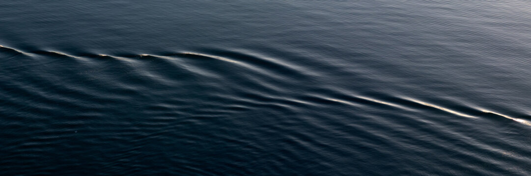 Panorama of ripples on water for use as a an abstract background texture