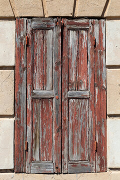Old wooden door set in stone wall
