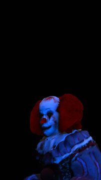 Creepy seamless vertical video of horror clown dancing. Funny Halloween background of a terror character isolated with copy space