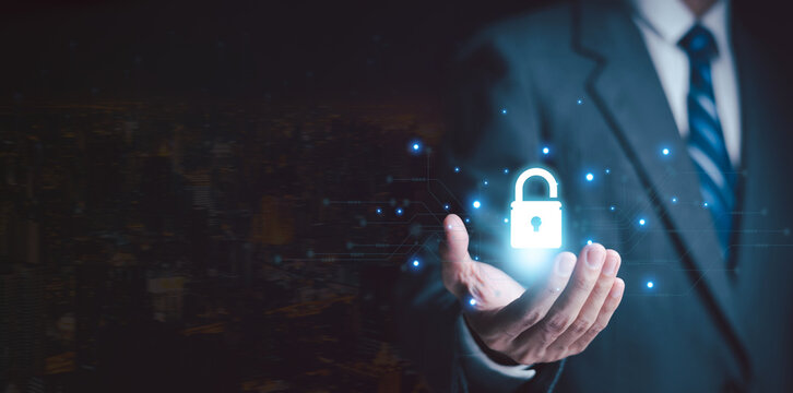 Cybersecurity and data protection concept featuring a glowing digital padlock, business professional, and electronic circuits, symbolizing privacy, network security, encryption, and secure access.