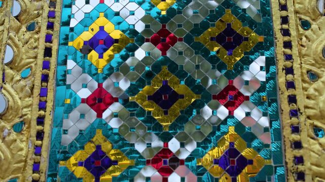 Intricate Colorful Glass Mosaic and Gilded Carvings on Thai Temple Pillar
