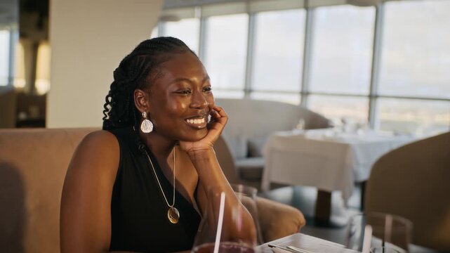 Caucasian waiter serving meals to young adult African American couple having romantic dinner in restaurant. Clip suited for hospitality service and fine dining commercials