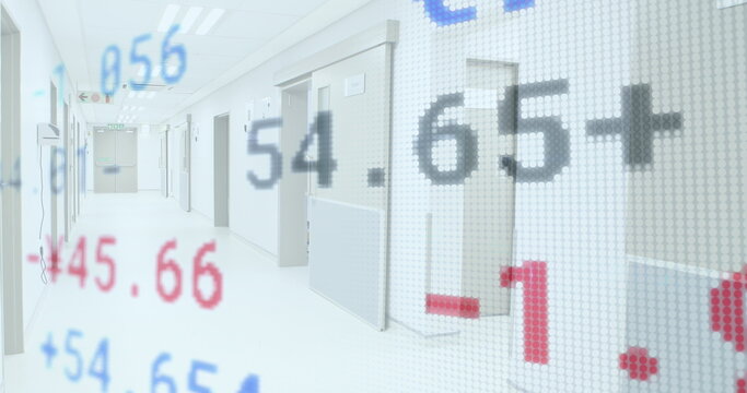 Stock market data overlaying empty hospital corridor, symbolizing healthcare finance