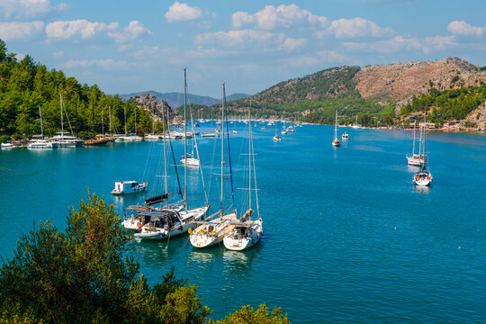Aerial view of boats anchored near the famous red sandbar of Kizkumu beach in Orhaniye, Marmaris, Turkey