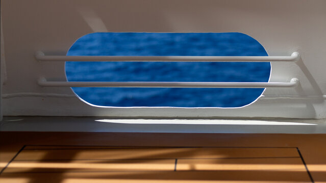 View of the sea through a ship scuttle opening