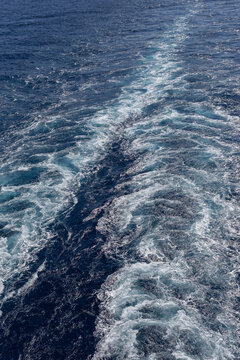 Waves and turbulence from the wake of a boat in the sea as a background texture