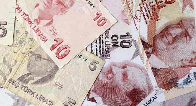 Turkish lira money bills in pile on table. Turkey TRY currency cash close up