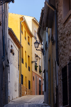 A picturesque street with colourful fa&ccedil;ades in the historic centre of Biar, Alicante, Spain