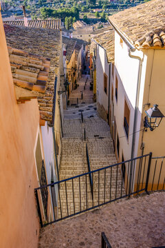 A picturesque treet of the historic centre of Biar, Alicante, Spain, with its colourful fa&ccedil;ades