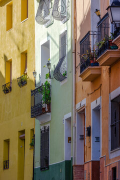 A picturesque street with colourful fa&ccedil;ades in the historic centre of Biar, Alicante, Spain