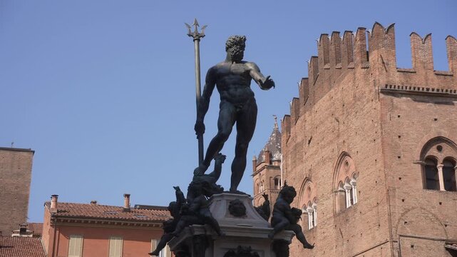 View of Neptune's Fountain in Piazza del Nettuno on a sunny day in Bologna, Emilia-Romagna, Bologna, Italy