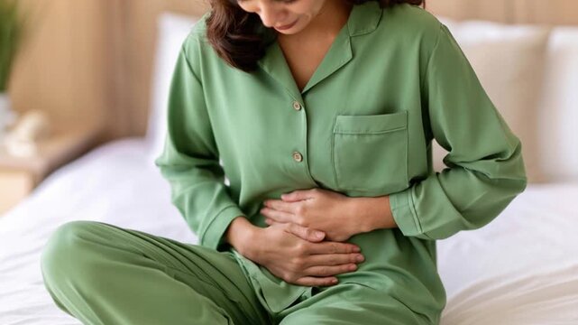 Woman Traveler in Hotel Room Suffering from Sudden Abdominal Pain
