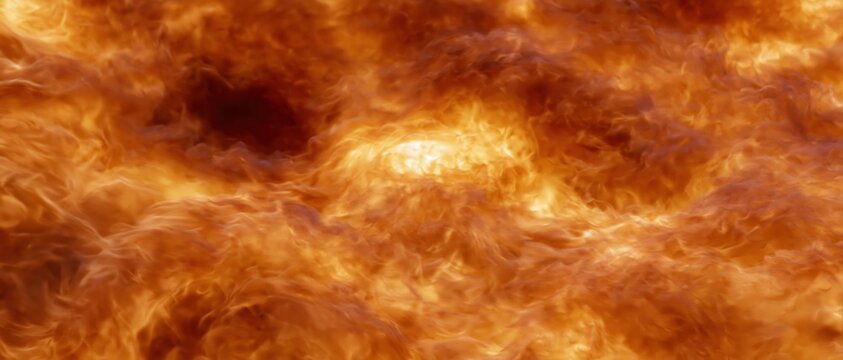 Close-up of swirling flames filling the frame with intense orange and yellow light