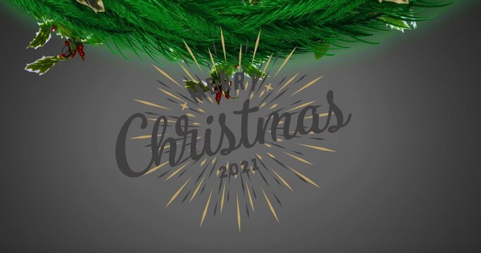 Featuring handwritten Christmas script with Merry 2021 in studio gray, starburst, pine and holly