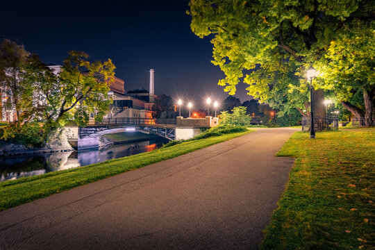 Wonderful night view of Bastion Hill (Kanalmalas ginks) park - ancient embankment hill located in the center of Riga opposite the Powder Tower. Picturesque summer cityscape of Riga, Latvia, Europe.