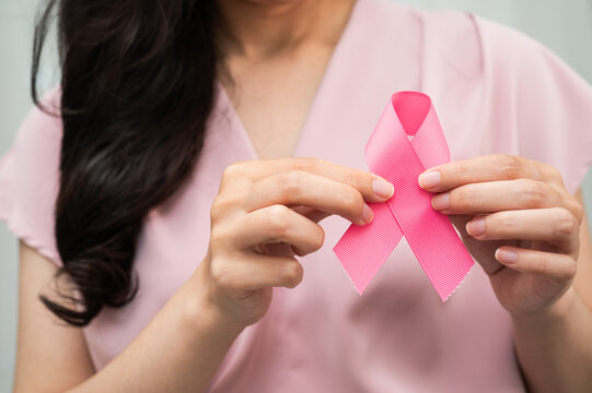 Asian woman with pink ribbon, World Breast Cancer Day at October.