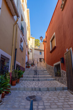 A picturesque corner of the historic centre of Biar, Alicante, Spain, with its colourful fa&ccedil;ades