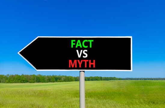 Fact vs versus myth words symbol. Concept words Fact vs Myth on beautiful black road sign. Beautiful blue sky green grass background. Business and fact vs versus myth concept. Copy space.