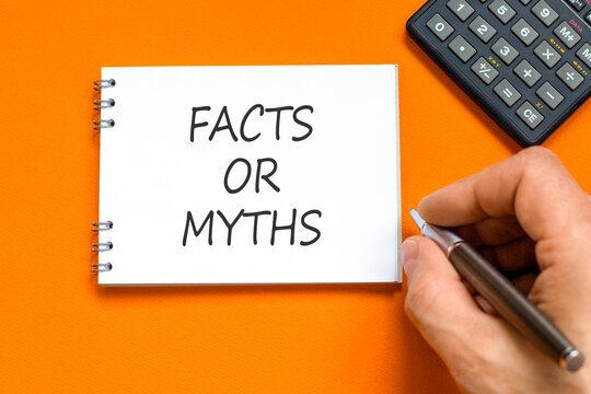 Facts or myths words symbol. Concept words Myths or Facts on beautiful white note. Beautiful orange background. Businessman hand. Business and facts or myths concept. Copy space.