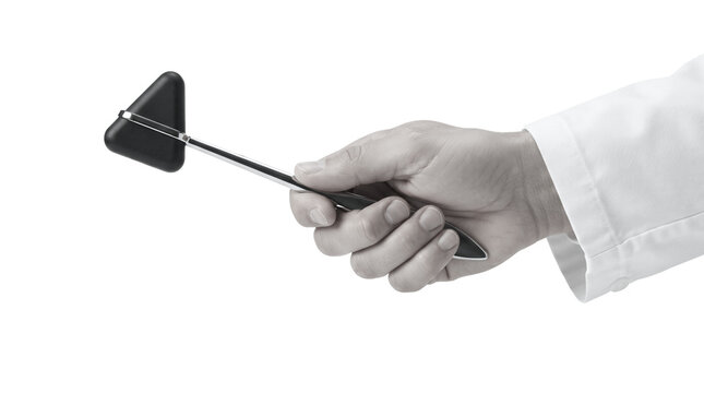 Doctor hand holding a neurological reflex hammer for medical examination in black and white