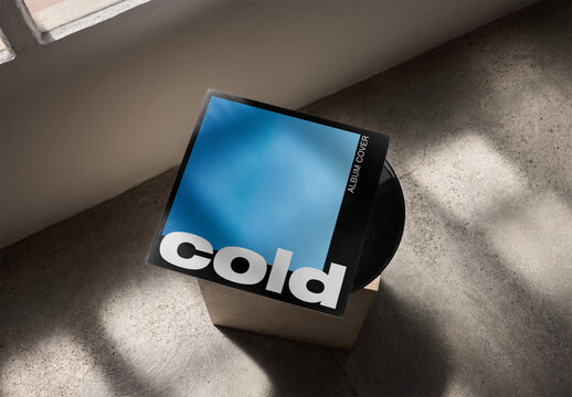 Mockup Of Customizable Record Sleeve On Wooden Pedestal, High Angle