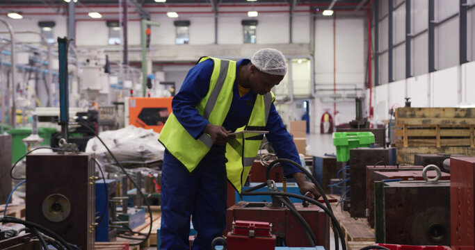 Young man works diligently in an industrial setting