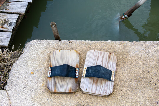 Wooden-soled slippers worn by salt pan workers