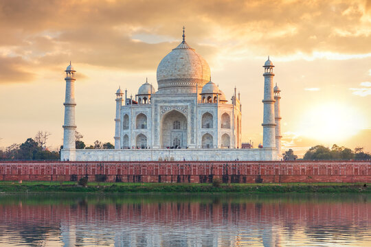 Epic Taj Mahal panorama at sunset reflected in Yamuna river Agra India