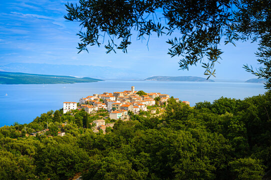Historic hilltop village Beli overlooking deep blue Adriatic Sea on Cres island Croatia