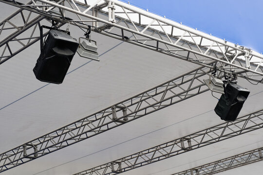 Suspended Loudspeakers and Floodlight Beneath a Canopy