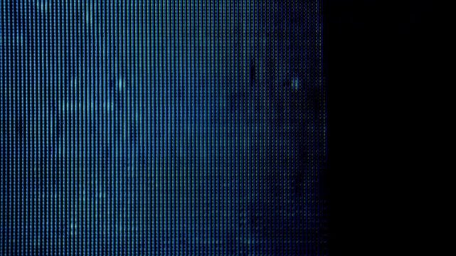 A macro shot of glowing television pixels displaying analog static, scanline distortion and digital noise.