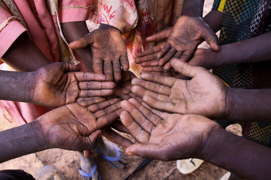 Open palms of children held together in a circle, Sahel Region, Gorom-Gorom, Burkina Faso