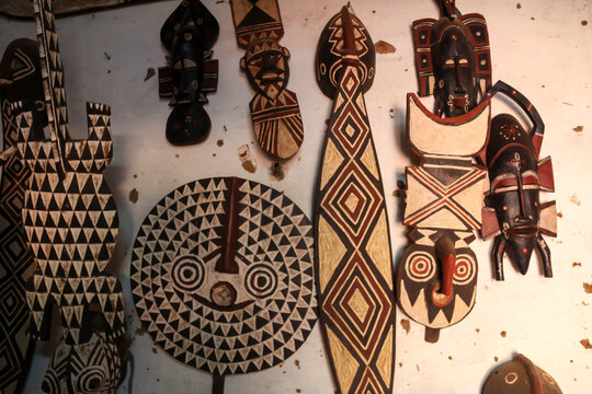 Painted wooden masks of the Bwa tribe hanging on a wall, Hauts-Bassins Region, Bobo Dioulasso, Burkina Faso