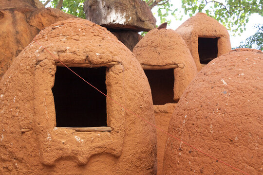 Clay granaries with square openings in the Abandoned Troglodyte Village, Cascades Region, Niansogoni, Burkina Faso