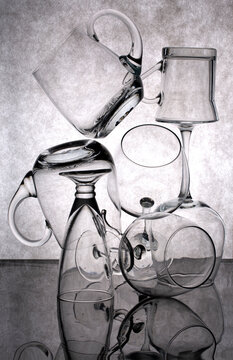 Still life with different glassware on a gray background