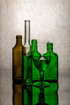 Still life with glassware on a reflective surface
