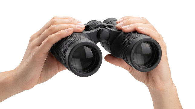 Close-up of human hands holding black binoculars isolated on a clean white background for travel and outdoor exploration concepts