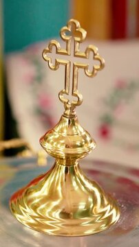 Orthodox Christian baptism of a baby in a church, featuring sacred icons, crosses, candles, and religious rituals symbolizing faith, spiritual blessings, and family traditions.