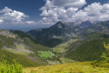Scenic panorama of Chocholowska Valley (Polana Chocholowska) and Kominiarski Wierch peak in Western Tatra Mountains seen from the trail to Grzes. © Mateusz