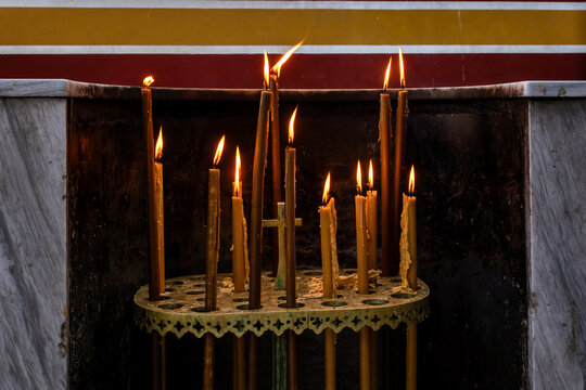 Burning prayer candles in an Orthodox Greek church